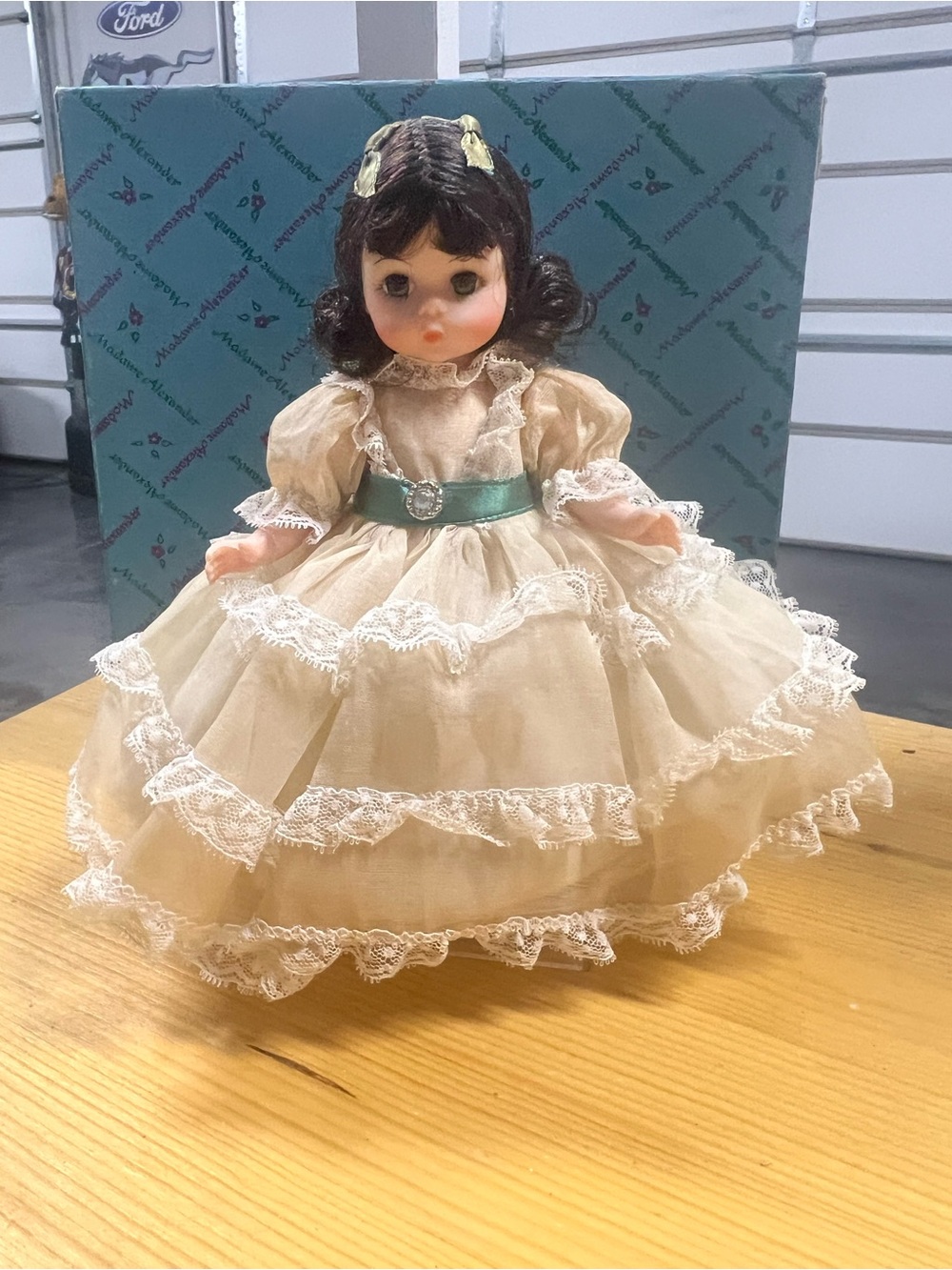 Madame Alexander Scarlett Doll in a Cream Lace Dress with Green Satin Sash